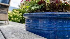 Close-up of a blue glazed, frost-proof ceramic planter texture.